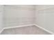 Walk-in closet equipped with wire shelving and neutral carpeting at 14914 15Th E St, Parrish, FL 34219