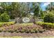 The 'Twin Rivers' stone community sign with pink flowers and landscaping at 14914 15Th E St, Parrish, FL 34219