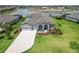 Beautiful single-Gathering home featuring a well-manicured lawn, neutral paint colors, and an attached two-car garage at 14914 15Th E St, Parrish, FL 34219
