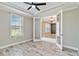 Office space with French doors, tile floors, tray ceiling, a window, and neutral paint colors at 14914 15Th E St, Parrish, FL 34219