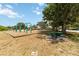 Community playground with swings, picnic tables, and a mature shade tree offers outdoor fun at 14914 15Th E St, Parrish, FL 34219