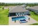 A beautiful backyard pool with lounge chairs in a lovely landscaped yard in this Florida home at 14914 15Th E St, Parrish, FL 34219