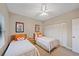 Comfortable bedroom with twin beds, closet, and ceiling fan at 1612 Starling Dr # 101, Sarasota, FL 34231