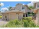 Beautiful exterior of a two-story home with a well-manicured lawn, attached garage, and tiled front walk at 1612 Starling Dr # 101, Sarasota, FL 34231