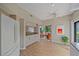 Bright kitchen with wood flooring, granite countertops, and an open layout with patio view at 1612 Starling Dr # 101, Sarasota, FL 34231