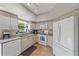 A modern kitchen with granite countertops, modern appliances, and bright natural light at 1612 Starling Dr # 101, Sarasota, FL 34231