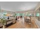Open concept living space with hardwood floors, comfortable seating, and screened lanai access at 1612 Starling Dr # 101, Sarasota, FL 34231