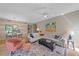 Spacious living room featuring hardwood floors, comfortable seating, and stylish decor at 1612 Starling Dr # 101, Sarasota, FL 34231