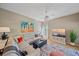 Bright living room with hardwood floors, a large sectional sofa, and an entertainment center at 1612 Starling Dr # 101, Sarasota, FL 34231
