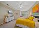 A main bedroom with bright decor, TV, neutral walls, with comfortable furniture and a ceiling fan at 1612 Starling Dr # 101, Sarasota, FL 34231