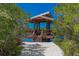 Charming waterfront gazebo offers a serene escape with scenic views, perfect for relaxation by the water at 1612 Starling Dr # 101, Sarasota, FL 34231