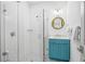 Bright, tiled bathroom featuring glass-enclosed shower and modern, well-lit vanity at 201 Bay N Dr, Bradenton Beach, FL 34217