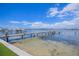 Beautiful view of a wooden dock leading out to the water on a sunny day at 201 Bay N Dr, Bradenton Beach, FL 34217