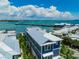 A stunning two-story home with a metal roof and ocean views at 201 Bay N Dr, Bradenton Beach, FL 34217