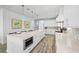 Contemporary kitchen featuring white cabinetry, quartz countertops, and stainless steel appliances at 201 Bay N Dr, Bradenton Beach, FL 34217