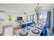 Open living area showcasing a dining table, stylish decor, and picturesque waterfront views at 201 Bay N Dr, Bradenton Beach, FL 34217