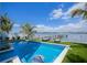 An outdoor pool with sunning chairs and waterfront views at 201 Bay N Dr, Bradenton Beach, FL 34217