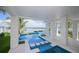 Picturesque pool area with a stunning view of the dock and ocean beyond at 201 Bay N Dr, Bradenton Beach, FL 34217