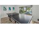 Recreation room featuring a ping pong table with an outdoor view of the pool at 201 Bay N Dr, Bradenton Beach, FL 34217