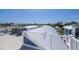 A rooftop features decking, HVAC units, and neighborhood views at 201 Bay N Dr, Bradenton Beach, FL 34217