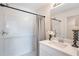 Clean bathroom features a tiled shower with a glass door, a stylish vanity, and modern fixtures at 20276 Emerald Ave, Port Charlotte, FL 33952