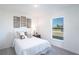 Comfortable bedroom with a calming color palette and a bright window view at 20276 Emerald Ave, Port Charlotte, FL 33952