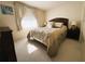 Comfortable bedroom featuring a queen-size bed and light-colored carpet, creating a cozy retreat at 2107 Palma Sola Blvd # 95, Bradenton, FL 34209