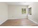 Empty bedroom with natural light and hardwood floors, offering a peaceful and serene atmosphere at 214 49Th W St, Bradenton, FL 34209