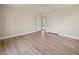 Bright, empty bedroom with light wood floors and a double closet providing ample storage space at 214 49Th W St, Bradenton, FL 34209