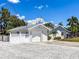 Charming home with a white exterior, garage, manicured landscaping, and a spacious driveway at 214 49Th W St, Bradenton, FL 34209