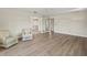 Spacious living room with stylish flooring and neutral decor, perfect for entertaining or relaxing at 214 49Th W St, Bradenton, FL 34209