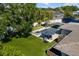 Aerial view of the backyard with swimming pool, hot tub, putting green, and outdoor seating areas at 2202 Alpine Ave, Sarasota, FL 34239