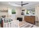 Charming Bedroom featuring a white crib, a changing table dresser and a decorative black trunk at 2202 Alpine Ave, Sarasota, FL 34239