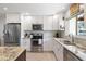 Bright kitchen featuring stainless steel appliances, stylish countertops, and white cabinetry at 2202 Alpine Ave, Sarasota, FL 34239