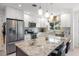 Modern kitchen with granite countertops, stainless steel appliances, and tiled backsplash at 2202 Alpine Ave, Sarasota, FL 34239