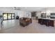 Open-concept living area connecting to the kitchen and featuring a large sliding glass door to the pool area at 2202 Alpine Ave, Sarasota, FL 34239