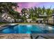 Relaxing pool and jacuzzi area with lounge chairs and mature trees for privacy and shade at 2202 Alpine Ave, Sarasota, FL 34239