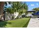 Fun backyard putting green with well-maintained artificial turf provides a great spot to practice your short game at 2202 Alpine Ave, Sarasota, FL 34239