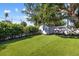 Quaint backyard with a well-maintained shed and artificial turf at 2202 Alpine Ave, Sarasota, FL 34239
