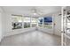 Bright sun room with tiled floor and backyard view at 2202 Alpine Ave, Sarasota, FL 34239
