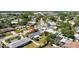 Aerial view of a charming home with a well-maintained yard in a quiet neighborhood at 2307 Valencia Dr, Sarasota, FL 34239