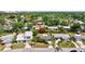 Aerial view of a charming home nestled among lush trees in a quiet neighborhood at 2307 Valencia Dr, Sarasota, FL 34239