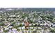 Aerial view of a home nestled in a lush, green neighborhood, showcasing its prime location and surrounding natural beauty at 2307 Valencia Dr, Sarasota, FL 34239