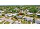 Aerial view of a charming neighborhood showcasing a well-maintained home with lush greenery and a spacious yard at 2307 Valencia Dr, Sarasota, FL 34239