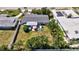 Aerial view of the property showcasing the home, yard, and surrounding neighborhood at 2307 Valencia Dr, Sarasota, FL 34239