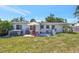 Spacious backyard with a patio, seating, hot tub and meticulous landscaping at 2307 Valencia Dr, Sarasota, FL 34239