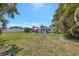 Beautiful backyard offers ample space and lush, mature landscaping at 2307 Valencia Dr, Sarasota, FL 34239