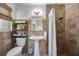 Tiled bathroom features a pedestal sink and shower at 2307 Valencia Dr, Sarasota, FL 34239