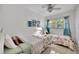 Bright bedroom with twin beds, neutral walls, and a ceiling fan for comfort at 2307 Valencia Dr, Sarasota, FL 34239