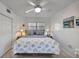 Cozy bedroom features a ceiling fan, closet, and a serene ambiance at 2307 Valencia Dr, Sarasota, FL 34239